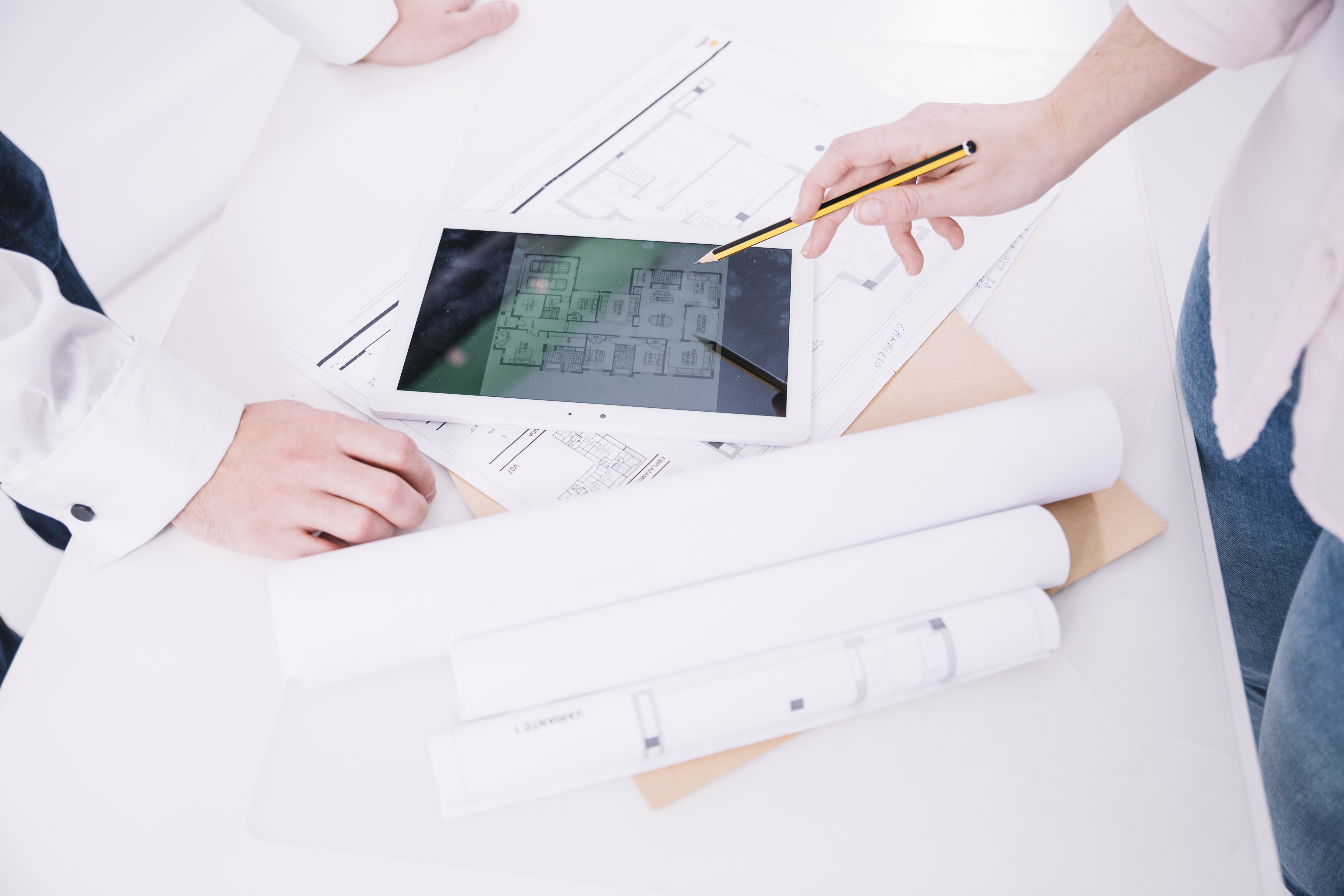 crop engineers working with drafts tablet